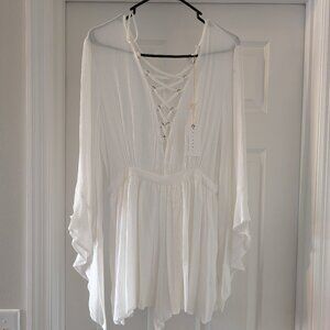 New tags on:  Off-white romper with criss cross top